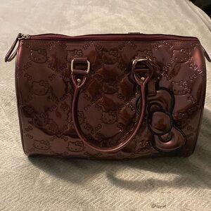 Metallic purple hello kitty duffel bag used once.